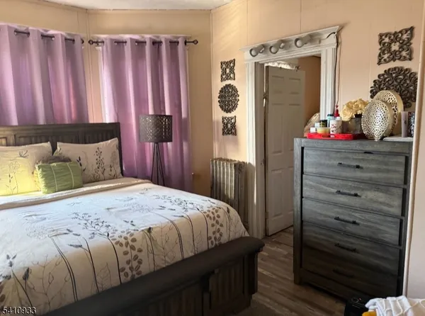 a bedroom with a bed and a closet