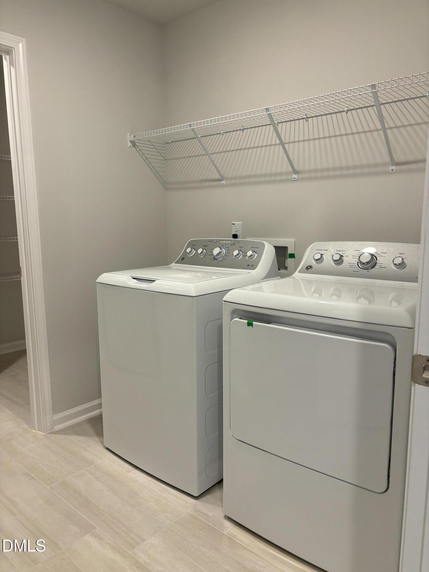 2011 Rabbit Hop Trail Apex, NC 27502 - Photo 18 of 27 a utility room with dryer and washer