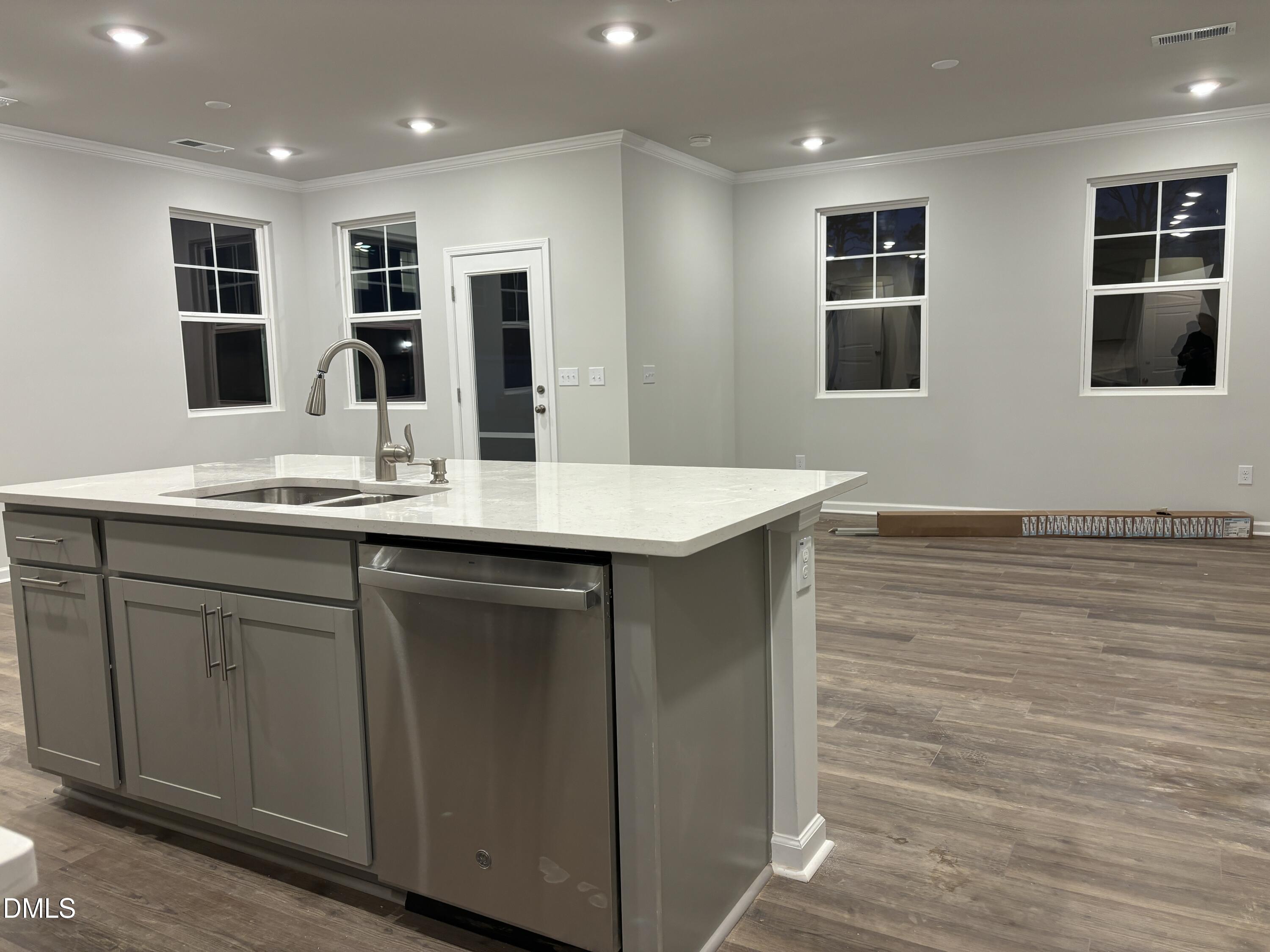 2011 Rabbit Hop Trail Apex, NC 27502 - Photo 8 of 27 a kitchen with stainless steel appliances granite countertop a sink and cabinets