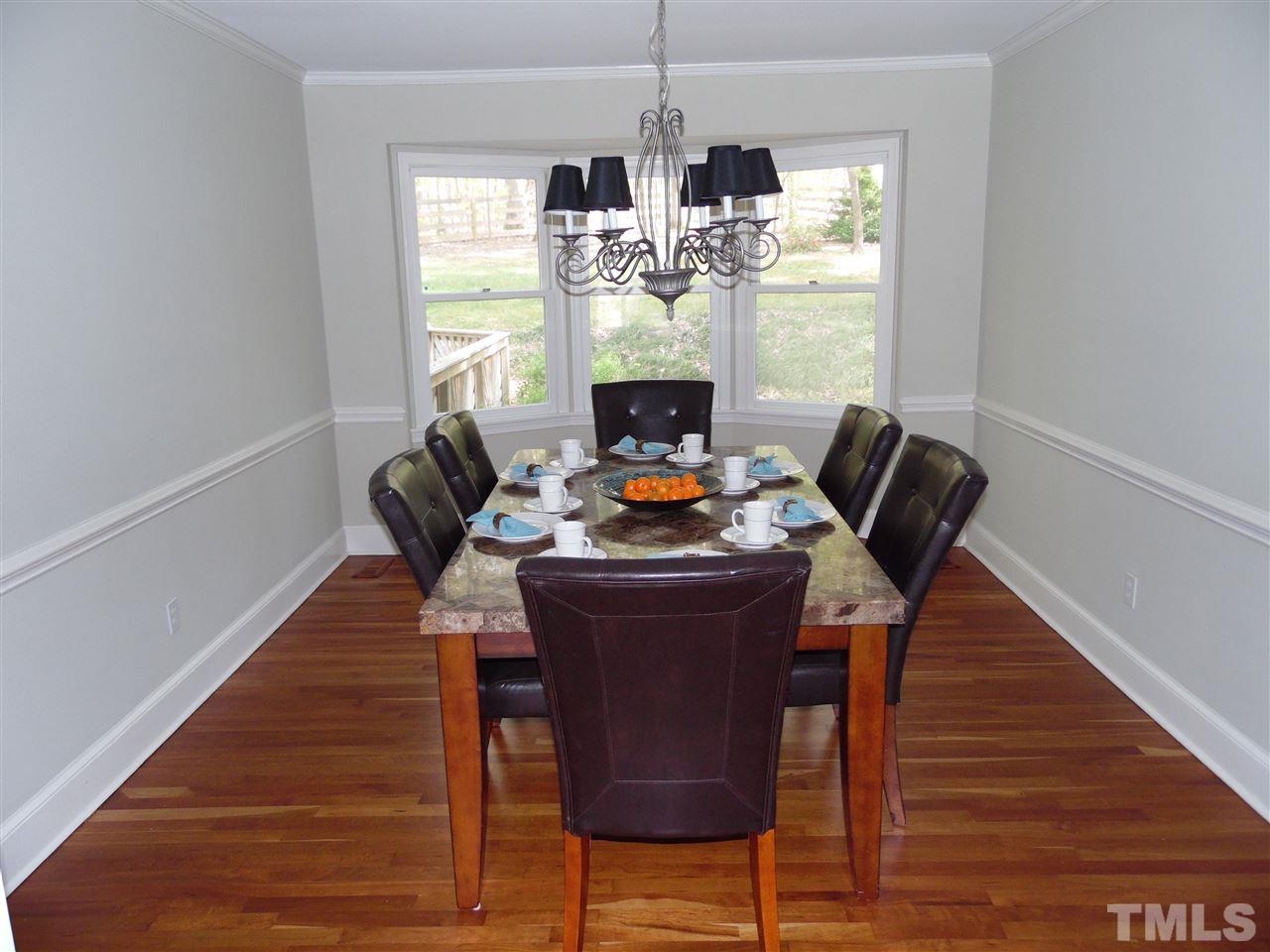 8604 Oneal Road Raleigh, NC 27613 - Photo 3 of 19 a living room with furniture and a fireplace