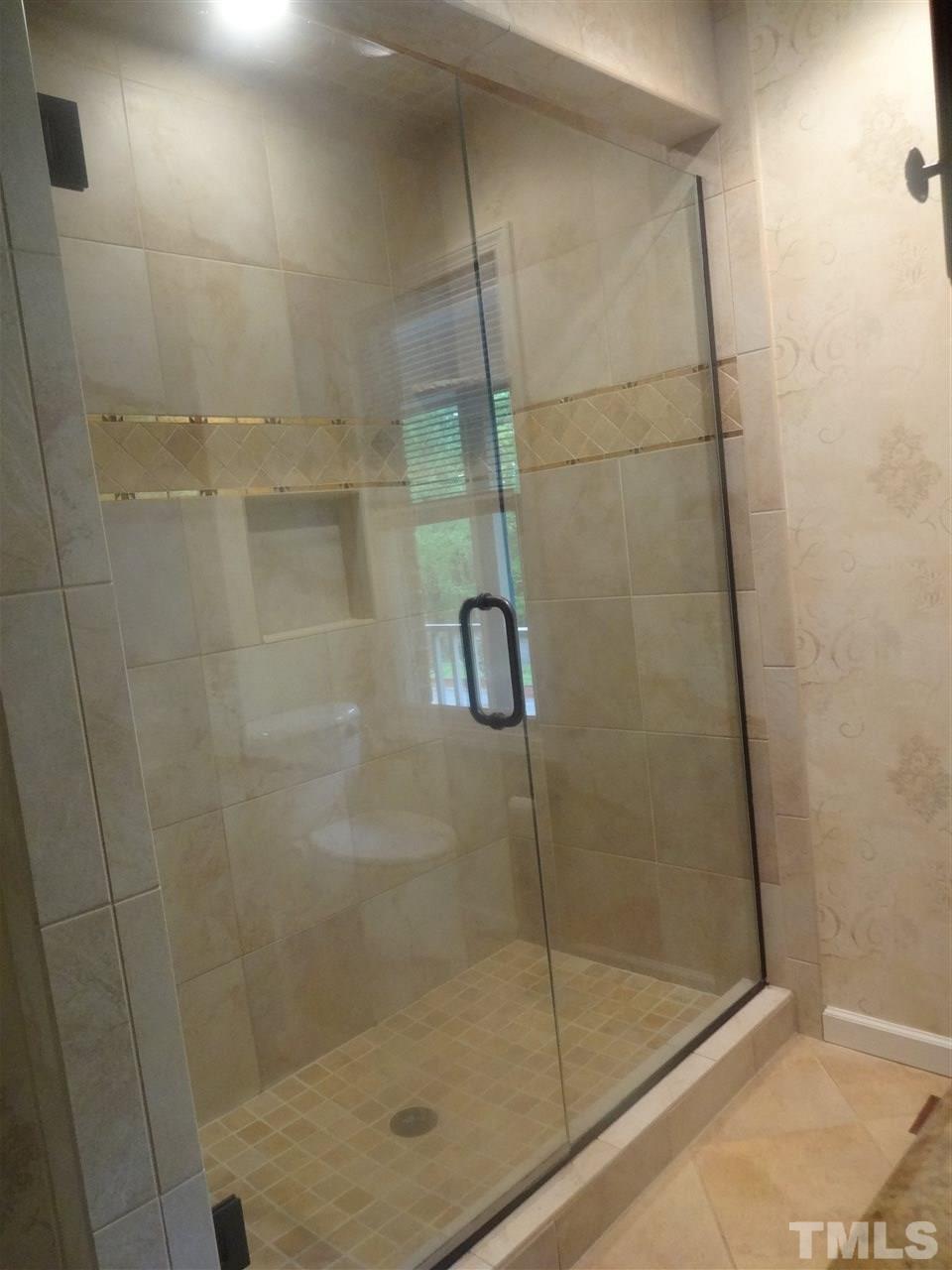 8604 Oneal Road Raleigh, NC 27613 - Photo 8 of 19 a bathroom with a shower