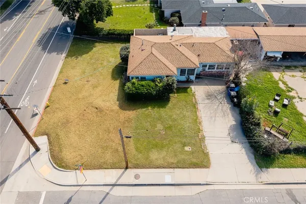 swimming pool view with a garden view