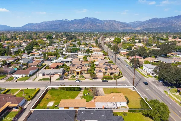 an aerial view of residential houses and outdoor space