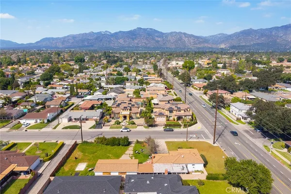 an aerial view of residential house and car parked