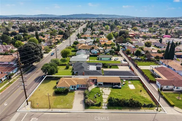 an aerial view of a house with a swimming pool