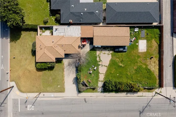 an aerial view of a house with a swimming pool