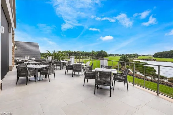 a view of a chairs and table in patio