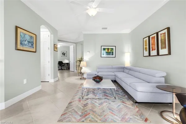 a living room with furniture and a window