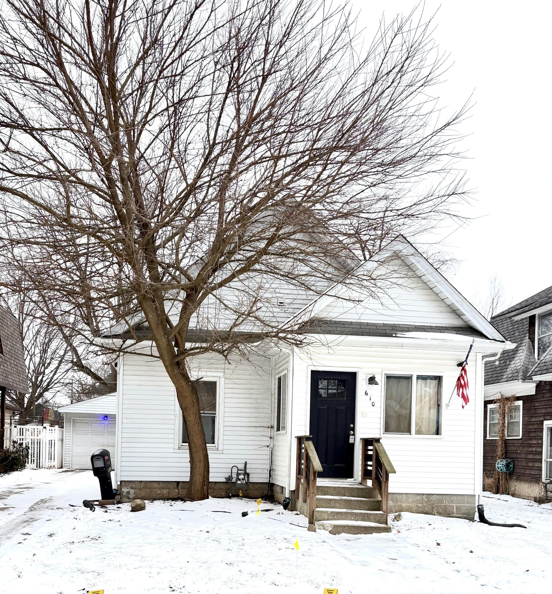 610 East Maple Avenue La Porte, IN 46350 - Photo 1 of 11 a view of a house with snow on the road