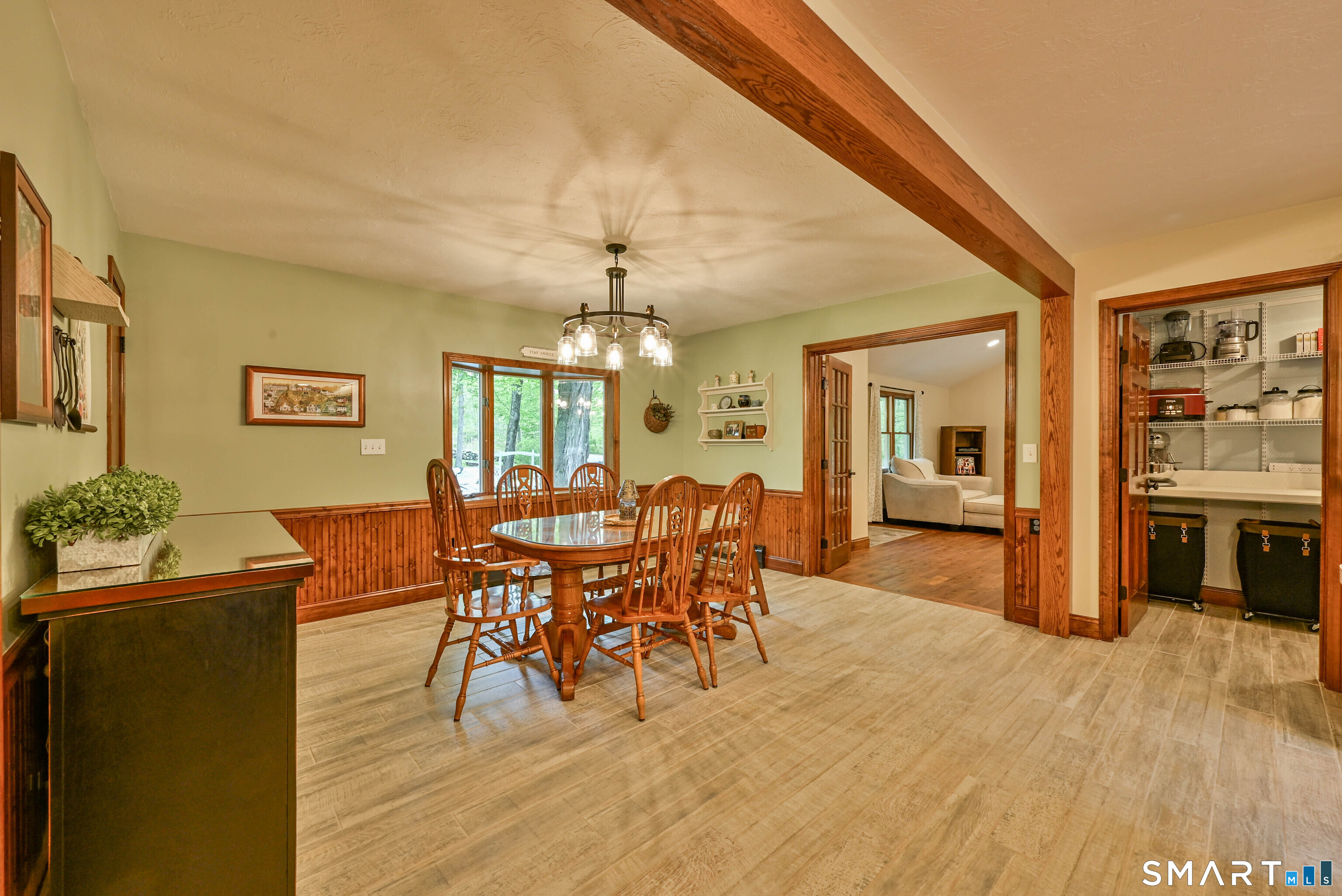309 O'Leary Road Thompson, CT 06277 - Photo 23 of 40 a view of a dining room with furniture and chandelier