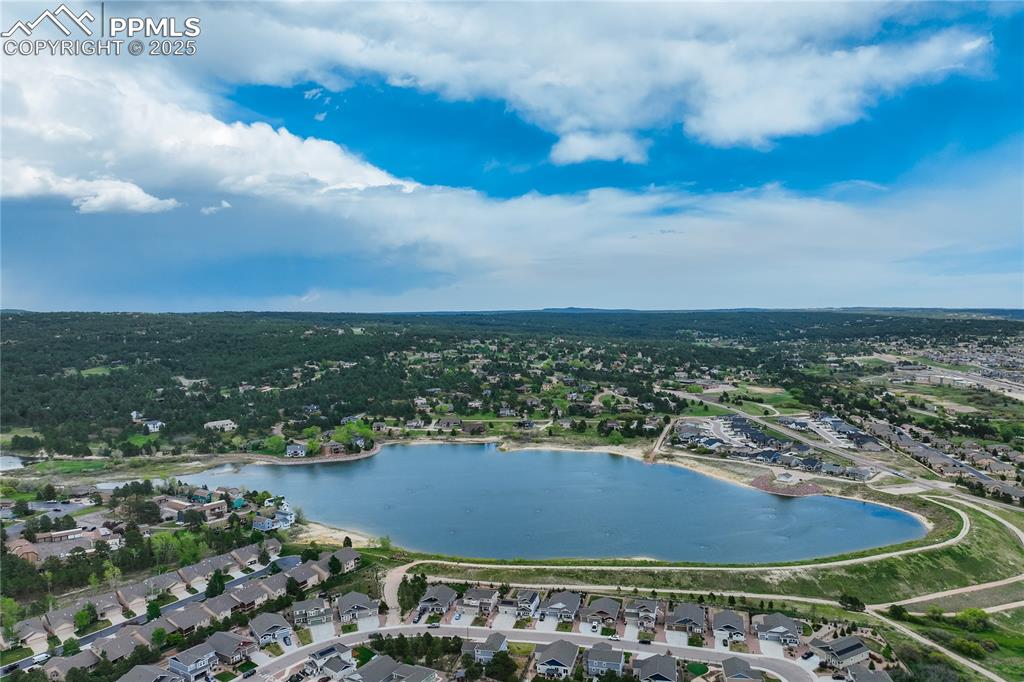 17960 Smugglers Road Monument, CO 80132 - Photo 20 of 31 a view of a lake and front of residential houses