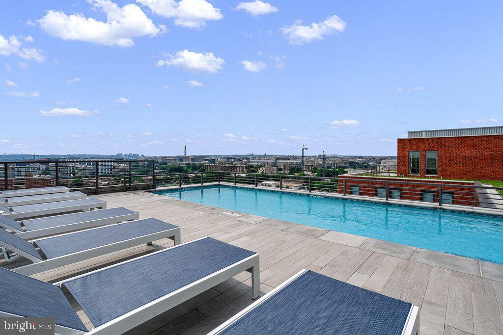 1211 Van Street Southeast, Unit 1007 Washington, DC 20003 - Photo 18 of 21 a view of a swimming pool and lounge chair