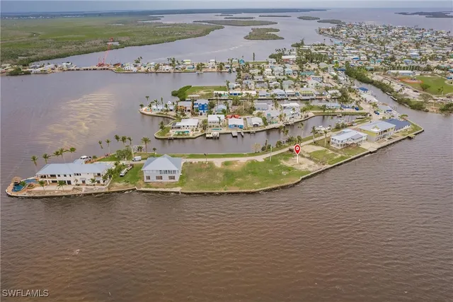 an aerial view of a house with a ocean view