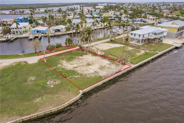 a view of a swimming pool with outdoor seating