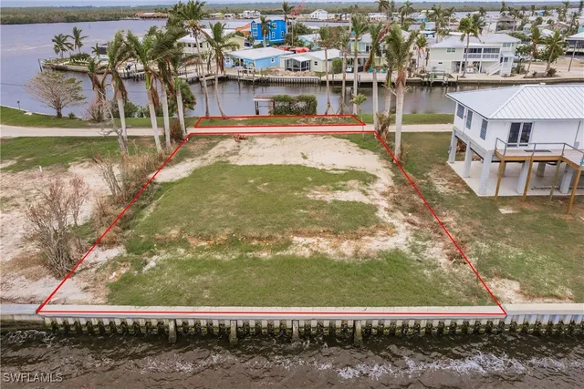 a view of swimming pool with outdoor seating and lake view