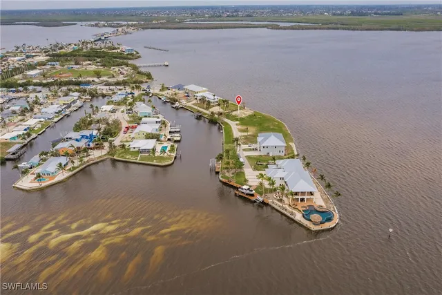 an aerial view of a house with a ocean view