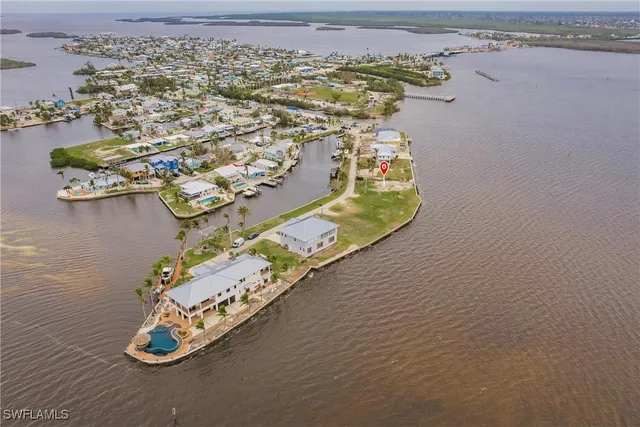 an aerial view of a house with a water view