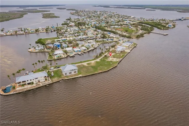 an aerial view of a house with a ocean view