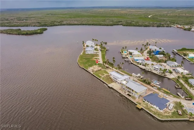 a view of a lake with a floor to ceiling window