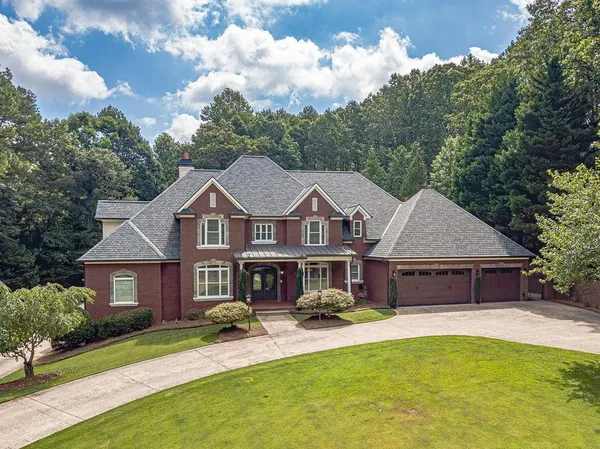 a front view of a house with yard porch and furniture