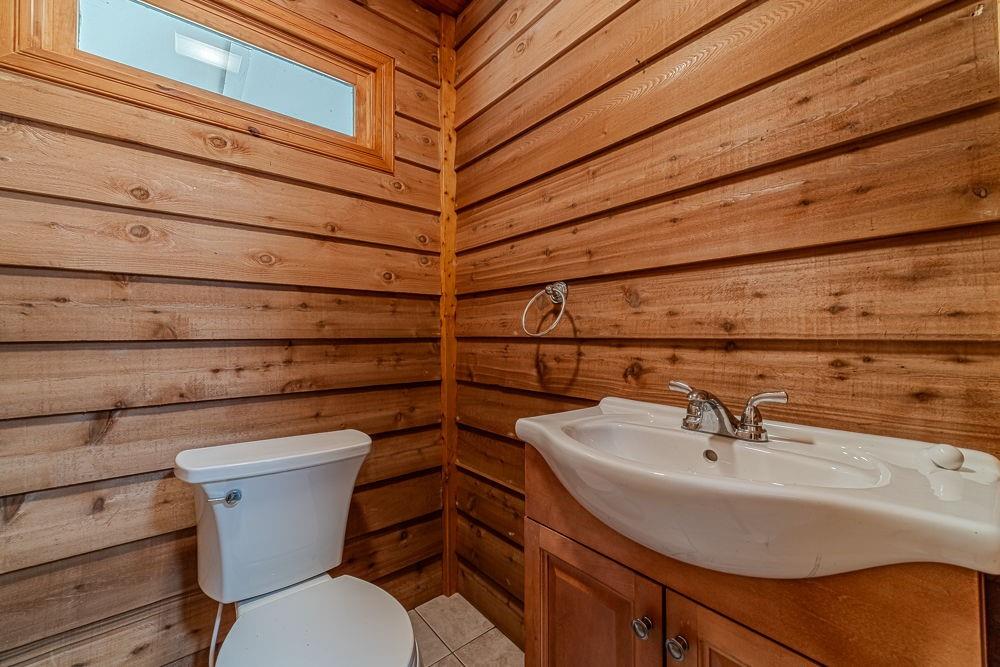 2431 Rabbit Farm Circle Loganville, GA 30052 - Photo 13 of 65 a bathroom with a sink and a toilet