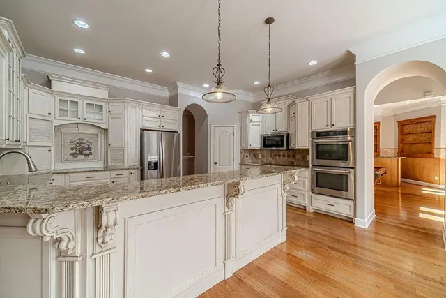 a bathroom with a granite countertop sink a mirror and a