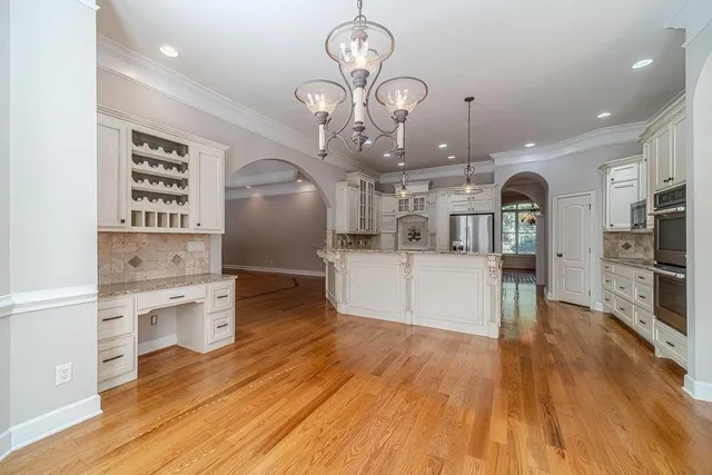 a bathroom with a shower sink and mirror
