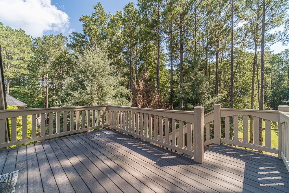 2431 Rabbit Farm Circle Loganville, GA 30052 - Photo 29 of 65 a view of balcony with wooden floor and fence