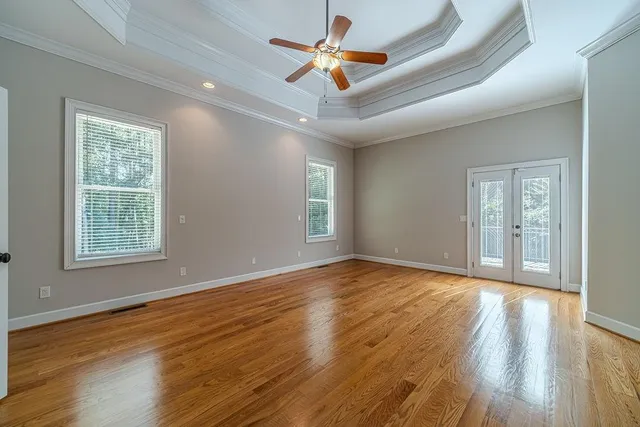 a view of an empty room and wooden floor