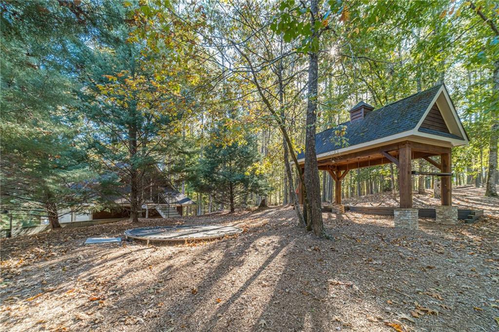 2431 Rabbit Farm Circle Loganville, GA 30052 - Photo 33 of 65 a view of a house with backyard and a tree