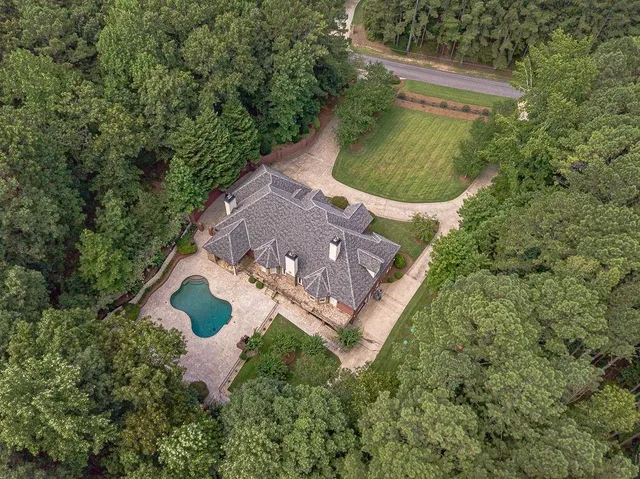 a view of a hallway with entryway wooden floor and front door
