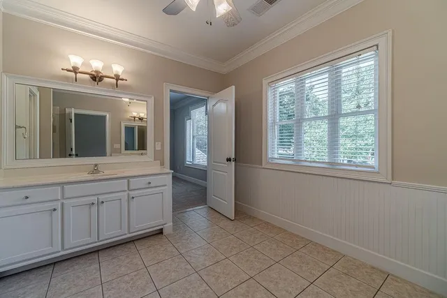 an aerial view of a house with a yard basket ball court and outdoor seating