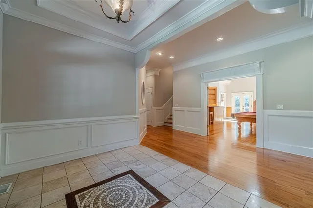 a kitchen with granite countertop a sink a stove and cabinets