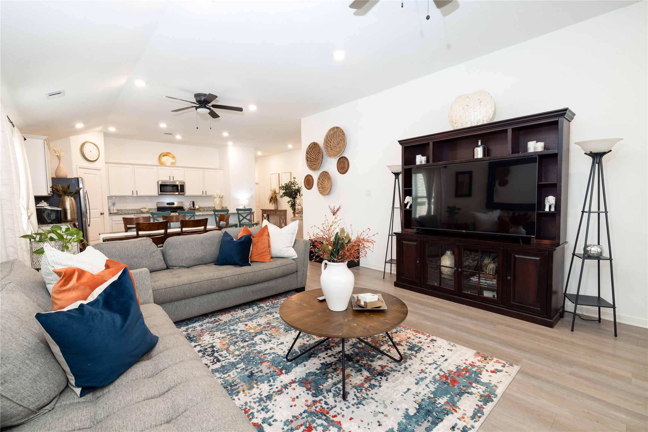 5715 Prairie Chapel Road Katy, TX 77493 - Photo 11 of 30 a living room with furniture and a flat screen tv