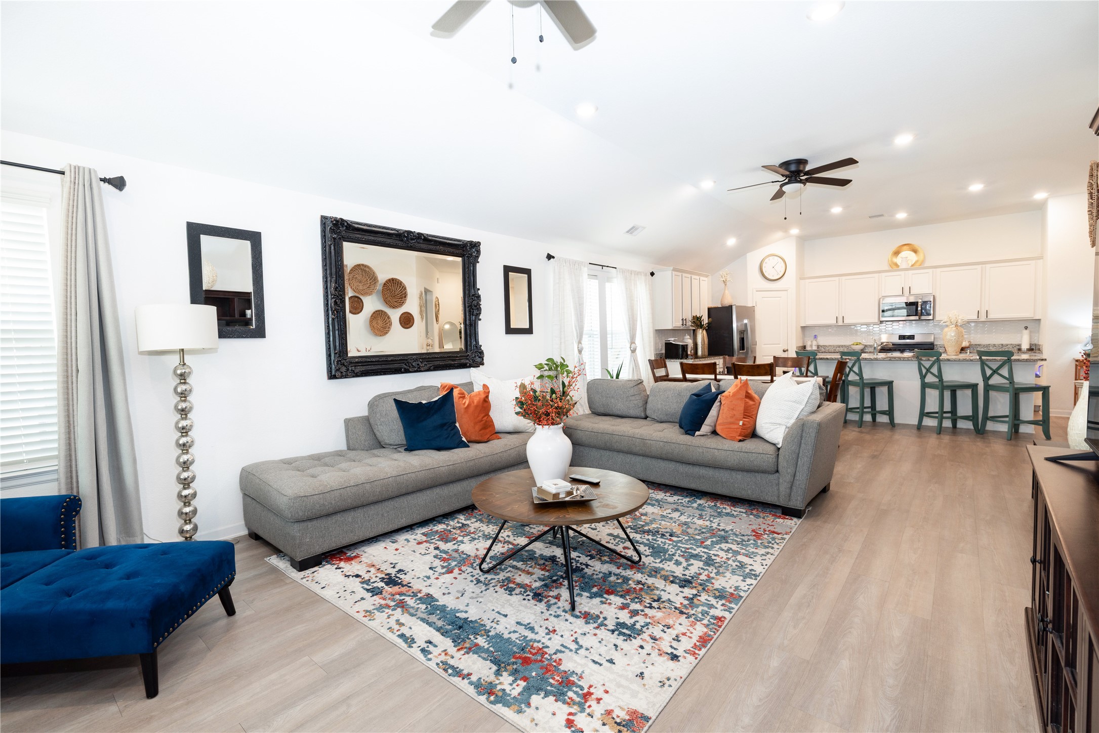 5715 Prairie Chapel Road Katy, TX 77493 - Photo 12 of 30 a living room with furniture and wooden floor