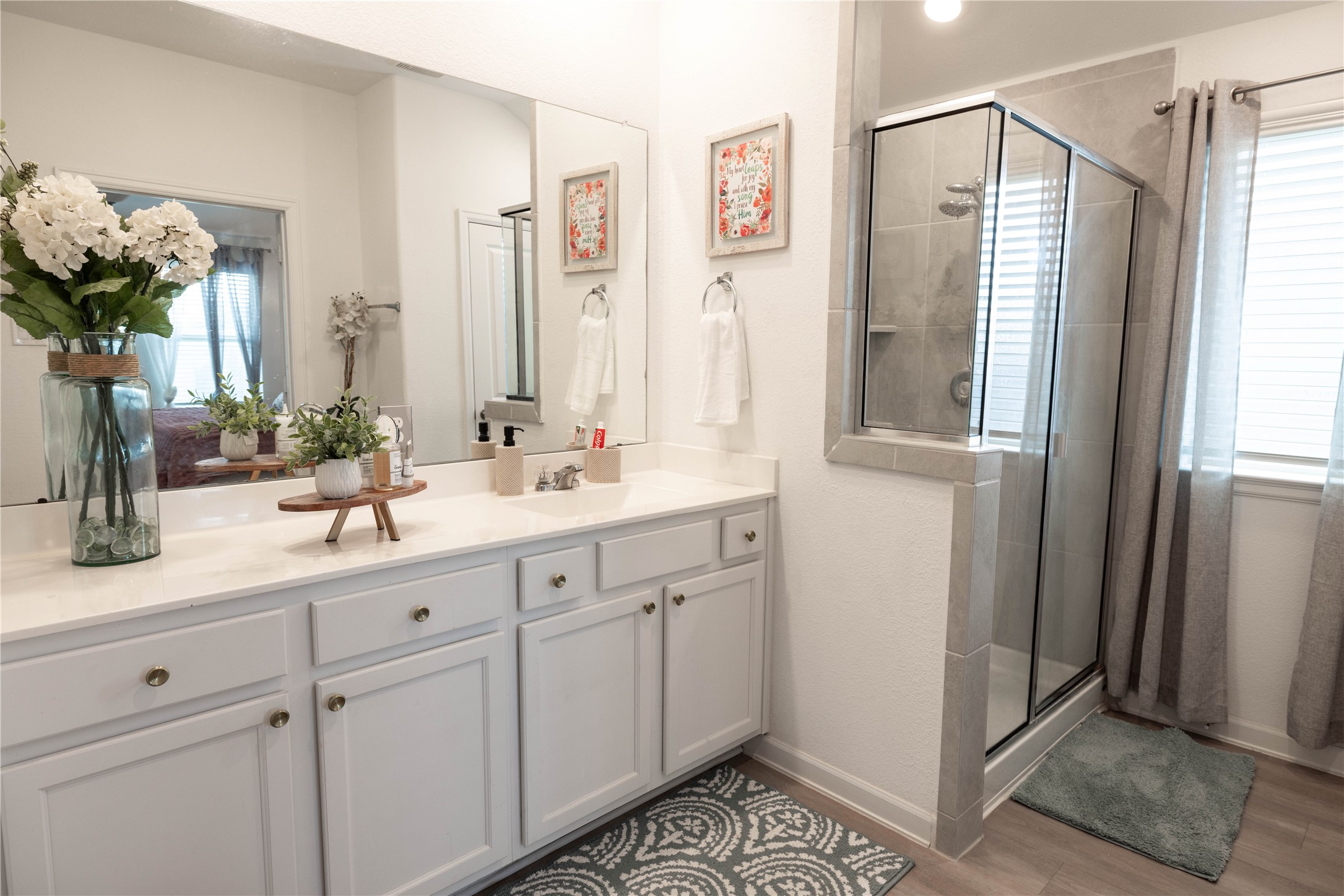 5715 Prairie Chapel Road Katy, TX 77493 - Photo 14 of 30 a bathroom with a shower sink and mirror