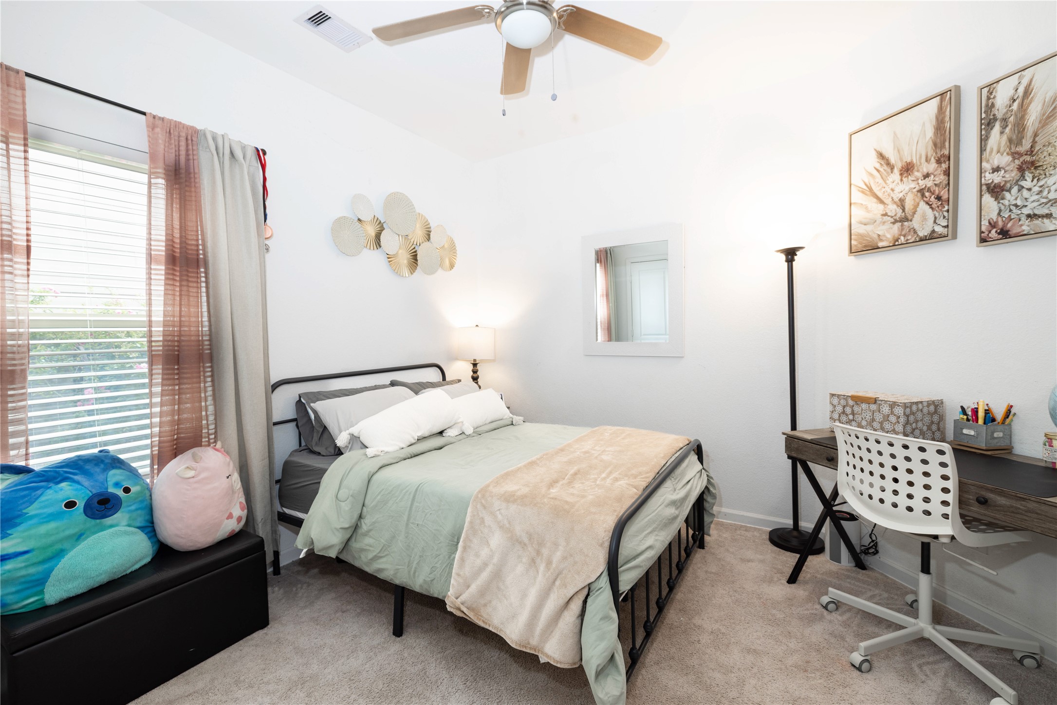 5715 Prairie Chapel Road Katy, TX 77493 - Photo 16 of 30 a bedroom with a bed and wooden floor