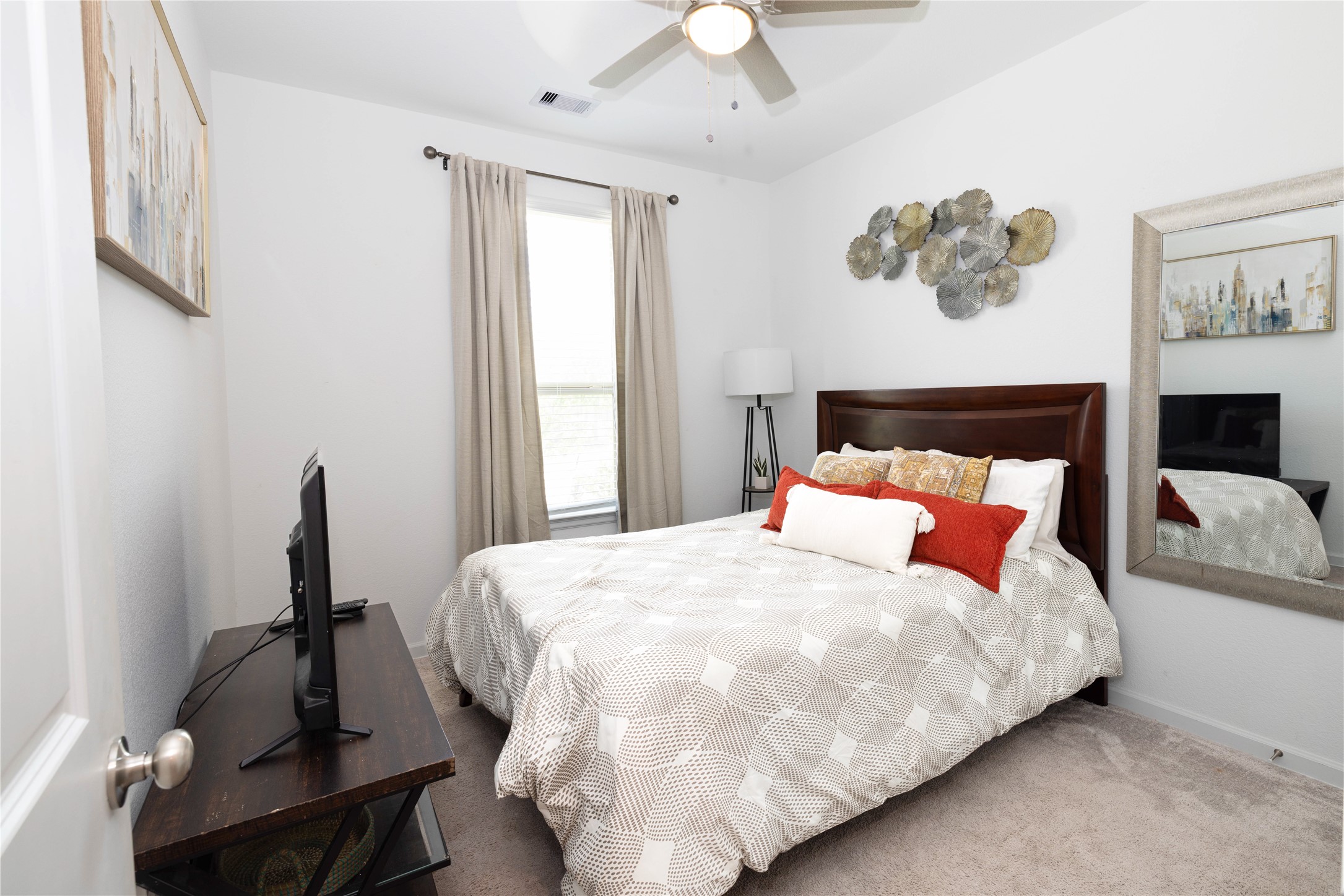 5715 Prairie Chapel Road Katy, TX 77493 - Photo 17 of 30 a bedroom with a bed and painting on the wall