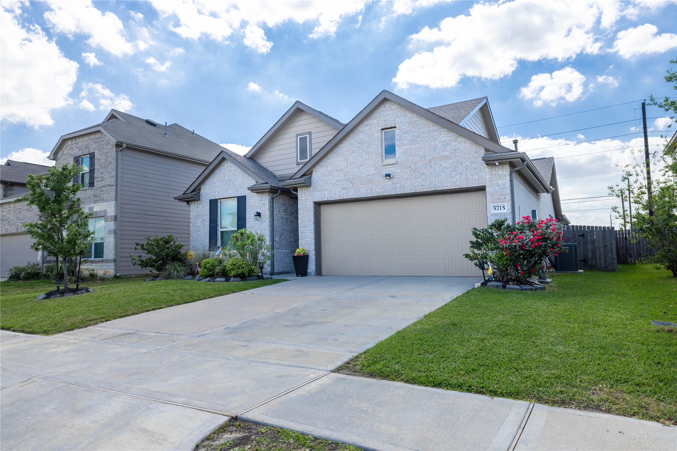 5715 Prairie Chapel Road Katy, TX 77493 - Photo 2 of 30 a front view of house with a garden