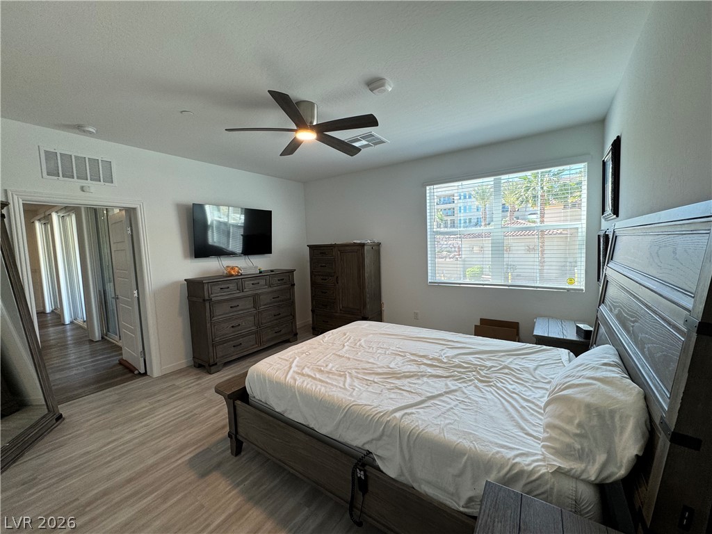2555 Hampton Road, Unit 4205 Henderson, NV 89052 - Photo 32 of 52 This airy bedroom offers comfortable living with elegant flooring and bright natural light.
