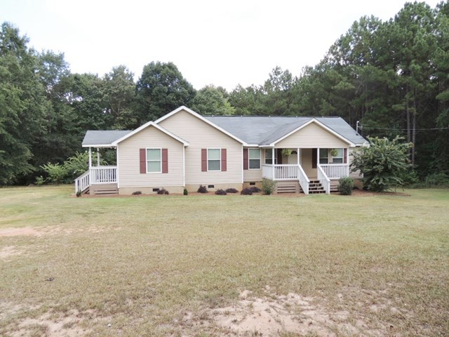 627 Old Cabaniss Road Forsyth, GA 31029 - Photo 20 of 20 a front view of a house with a garden