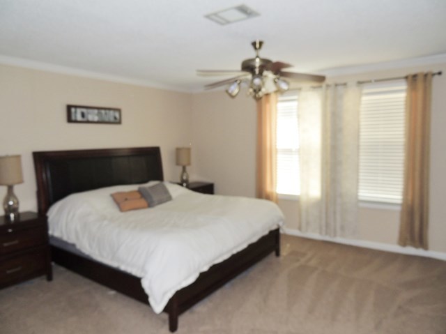 627 Old Cabaniss Road Forsyth, GA 31029 - Photo 7 of 20 a bedroom with a bed and a window