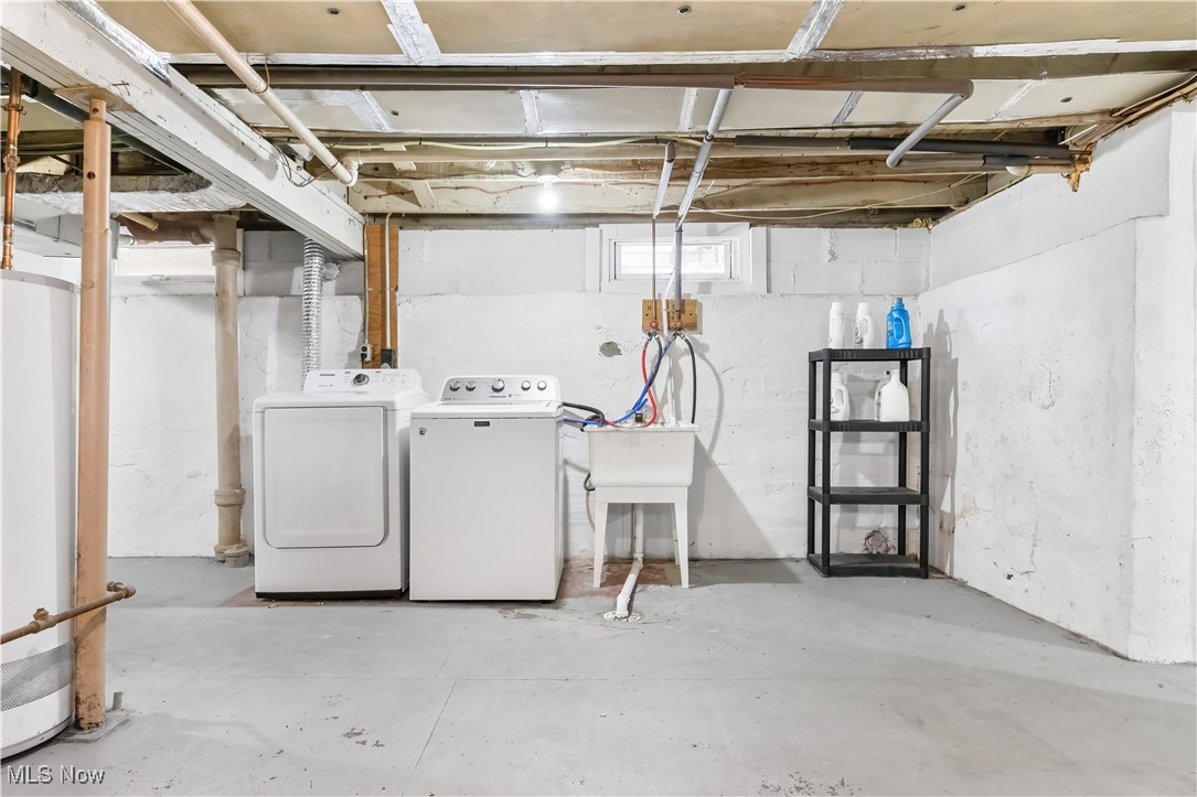 349 Gibbs Road Akron, OH 44312 - Photo 25 of 31 Basement with gas water heater and washer and clothes dryer
