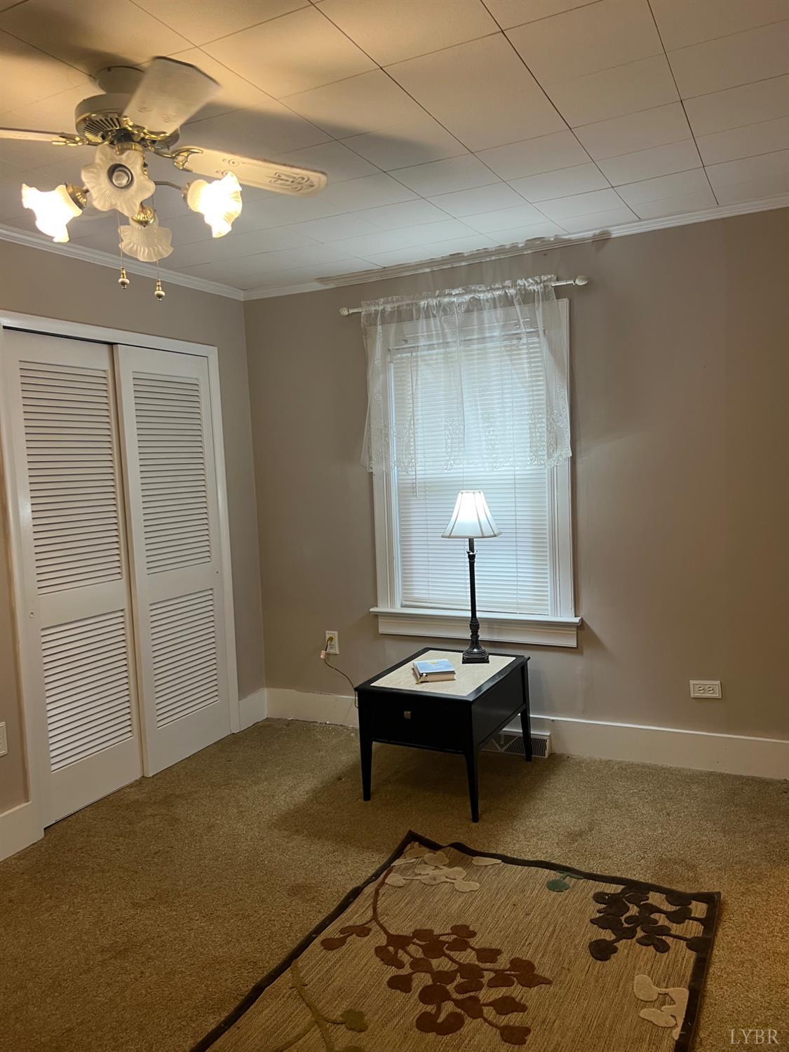 1573 Grit Road Hurt, VA 24563 - Photo 11 of 31 a living room with a table chairs and a chandelier