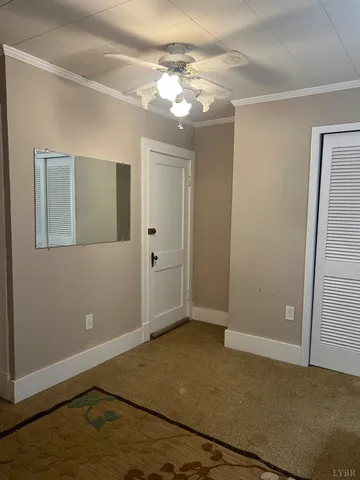 en empty room with window and wooden floor