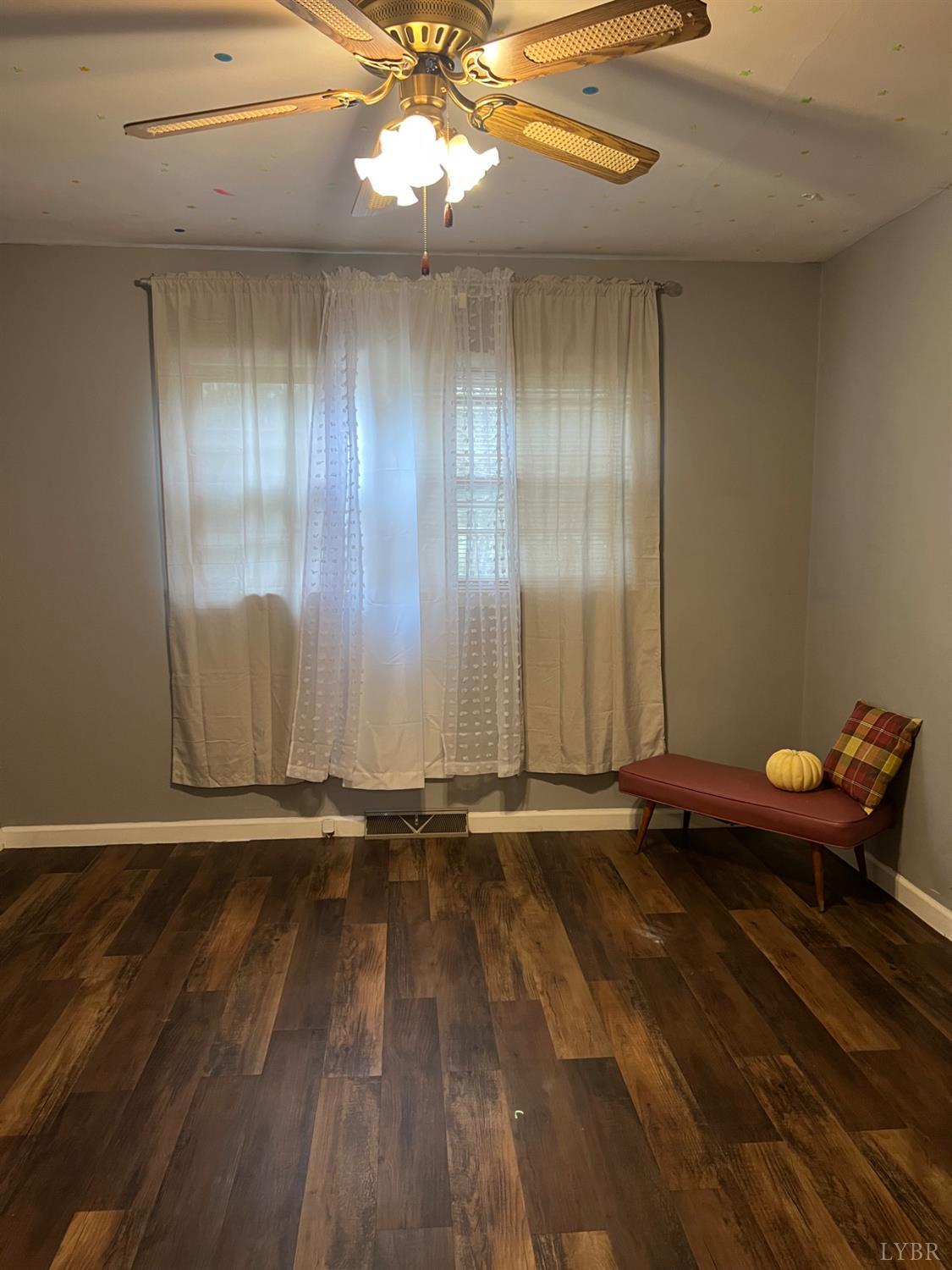 1573 Grit Road Hurt, VA 24563 - Photo 15 of 31 a view of room with hardwood floor and ceiling fan