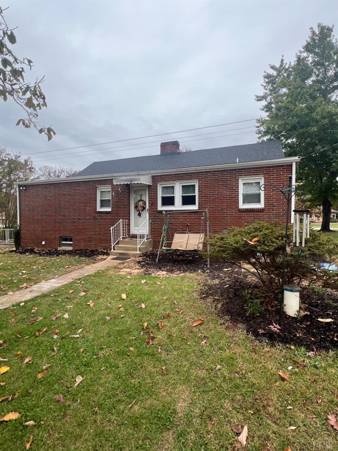 1573 Grit Road Hurt, VA 24563 - Photo 18 of 31 a backyard of a house with table and chairs