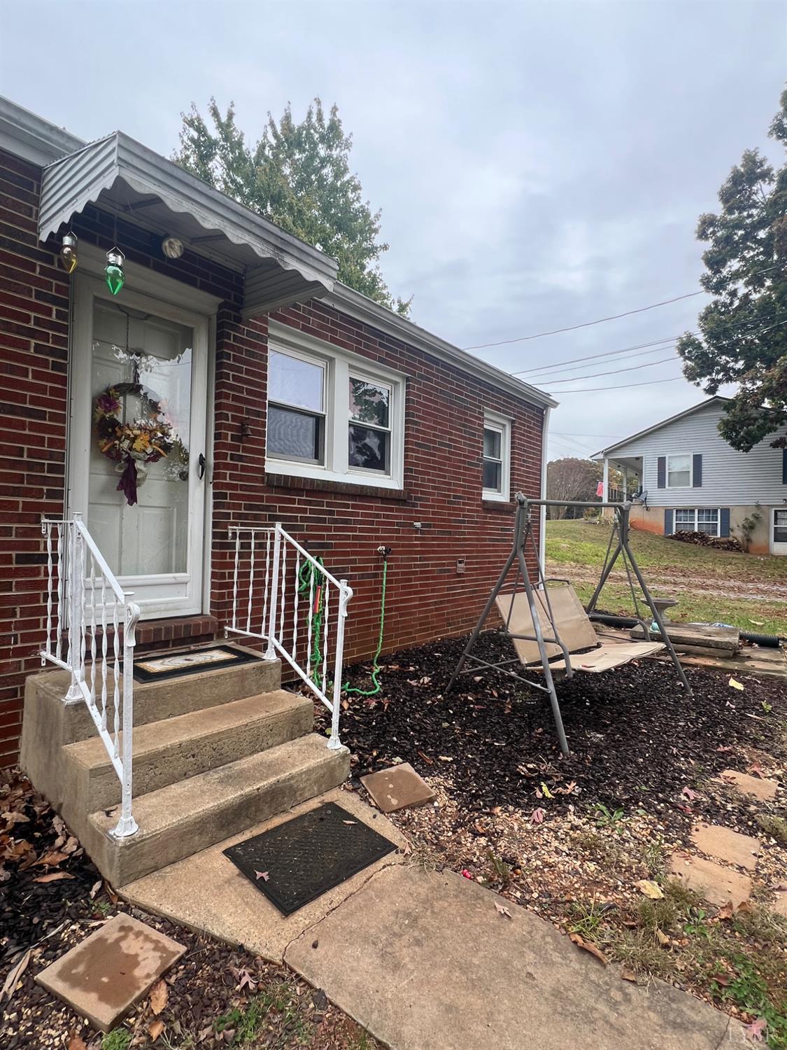 1573 Grit Road Hurt, VA 24563 - Photo 19 of 31 a view of a house with backyard and porch