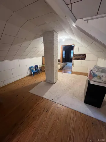 a view of a livingroom with an empty space and a window