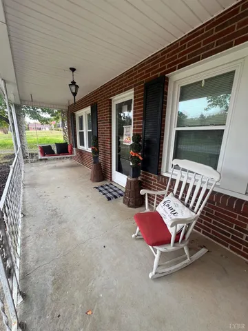a view of a patio with a table and chairs